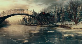 Movie still from “The Nutcracker and the Four Realms” (2018), directed by Joe Johnston – A train is crossing a bridge over a river; Extreme Wide shot, High angle