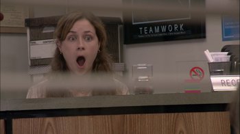 Movie still from “The Office” (2005), created by Ricky Gervais – A woman with her mouth open looking out a window; Close Up shot, Over the shoulder angle