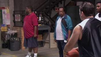 Movie still from “The Office” (2005), created by Ricky Gervais – Medium shot, Over the shoulder angle