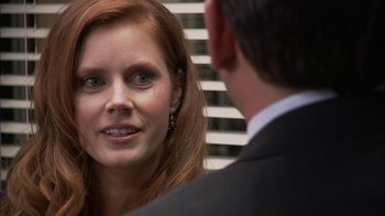 Movie still from “The Office” (2005), created by Ricky Gervais – A person talking to another person; Close Up shot, Over the shoulder angle