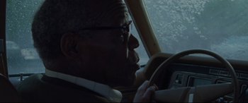 Movie still from “The Old Man & the Gun” (2018), directed by David Lowery – An older man sitting in the driver's seat of a car; Close Up shot, Over the shoulder angle