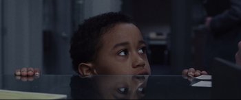 Movie still from “The Old Man & the Gun” (2018), directed by David Lowery – A young boy is looking up at the sky; Close Up shot, Over the shoulder angle