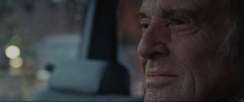 Movie still from “The Old Man & the Gun” (2018), directed by David Lowery – An old man sitting in the back seat of a car; Extreme Close Up shot, Over the shoulder angle