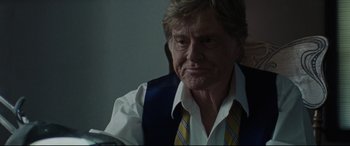Movie still from “The Old Man & the Gun” (2018), directed by David Lowery – An older man wearing a vest and a tie; Close Up shot, Low angle