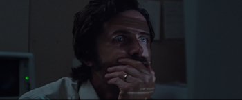 Movie still from “The Old Man & the Gun” (2018), directed by David Lowery – A person holding his hand to his face; Close Up shot, Low angle