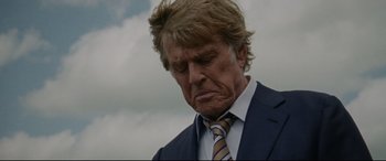 Movie still from “The Old Man & the Gun” (2018), directed by David Lowery – A person wearing a suit and tie; Close Up shot, Low angle