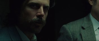 Movie still from “The Old Man & the Gun” (2018), directed by David Lowery – A person with a mustache; Close Up shot, Over the shoulder angle