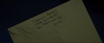 Movie still from “The Old Man & the Gun” (2018), directed by David Lowery – The back side of an envelope; Extreme Close Up shot, Overhead angle