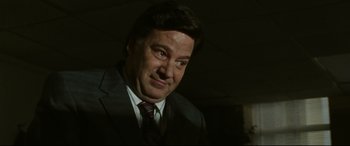 Movie still from “The Old Man & the Gun” (2018), directed by David Lowery – A person wearing a suit and tie; Close Up shot, Low angle