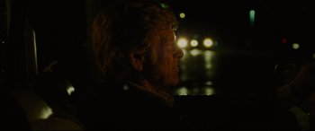 Movie still from “The Old Man & the Gun” (2018), directed by David Lowery – An older man looking out of a window at night; Close Up shot, Over the shoulder angle