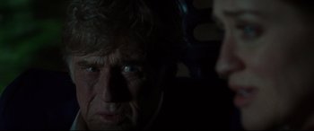 Movie still from “The Old Man & the Gun” (2018), directed by David Lowery – An old man with a beard and a white mustache; Close Up shot, Over the shoulder angle