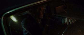 Movie still from “The Old Man & the Gun” (2018), directed by David Lowery – A man sitting in the driver's seat of a car at night; Close Up shot, Over the shoulder angle