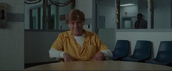 Movie still from “The Old Man & the Gun” (2018), directed by David Lowery – An older woman sitting at a table in a room; Medium shot, Over the shoulder angle