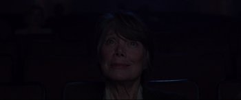 Movie still from “The Old Man & the Gun” (2018), directed by David Lowery – An older woman's face in the dark; Close Up shot, Low angle