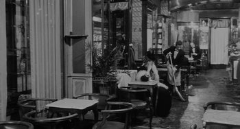 Movie still from “The Organizer” (1963), directed by Mario Monicelli – A black and white photo of people in a restaurant; Wide shot, High angle