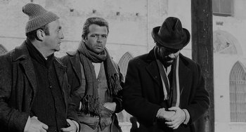 Movie still from “The Organizer” (1963), directed by Mario Monicelli – A group of men standing next to each other; Medium shot, Low angle