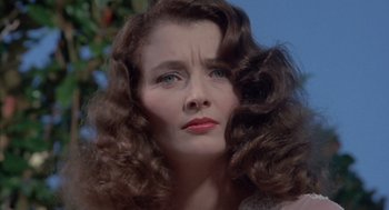 Movie still from “The Other” (1972), directed by Robert Mulligan – A person with long curly hair; Close Up shot, Low angle