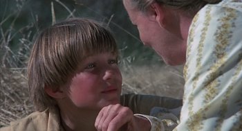 Movie still from “The Other” (1972), directed by Robert Mulligan – A man and a boy looking at one another; Close Up shot, Over the shoulder angle