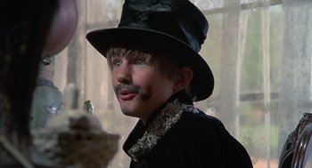 Movie still from “The Other” (1972), directed by Robert Mulligan – A young man wearing a black hat and a black jacket; Close Up shot, Low angle