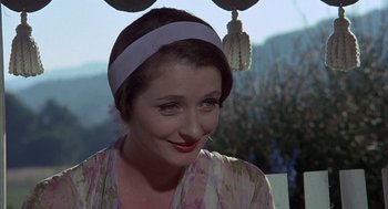 Movie still from “The Other” (1972), directed by Robert Mulligan – A person wearing a headpiece; Close Up shot, Over the shoulder angle