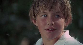 Movie still from “The Other” (1972), directed by Robert Mulligan – A young boy's face with blue eyes; Close Up shot, Low angle