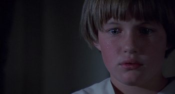 Movie still from “The Other” (1972), directed by Robert Mulligan – A boy's face with tears in his eyes; Close Up shot, Low angle
