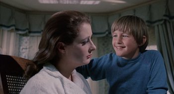 Movie still from “The Other” (1972), directed by Robert Mulligan – A woman and a young boy looking at each other; Close Up shot, Low angle