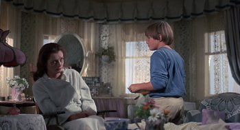 Movie still from “The Other” (1972), directed by Robert Mulligan – Two people sitting in a living room talking to each other; Medium shot, Over the shoulder angle
