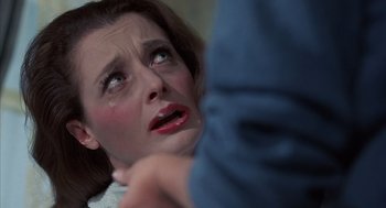 Movie still from “The Other” (1972), directed by Robert Mulligan – A person with a crying face; Close Up shot, Over the shoulder angle