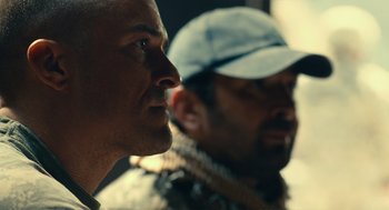 Movie still from “The Outpost” (2019), directed by Rod Lurie – Two men are looking into the distance; Close Up shot, Over the shoulder angle