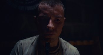 Movie still from “The Outpost” (2019), directed by Rod Lurie – A person holding a microphone; Close Up shot, Low angle