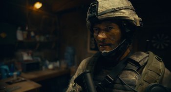 Movie still from “The Outpost” (2019), directed by Rod Lurie – A man in a military uniform holding a rifle; Close Up shot, Over the shoulder angle