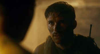 Movie still from “The Outpost” (2019), directed by Rod Lurie – A person with a face paint; Close Up shot, Over the shoulder angle