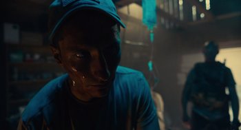 Movie still from “The Outpost” (2019), directed by Rod Lurie – A man in a blue hat and shirt; Close Up shot, Low angle