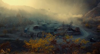 Movie still from “The Outpost” (2019), directed by Rod Lurie – A view of a small town in the middle of the day; Extreme Wide shot, High angle