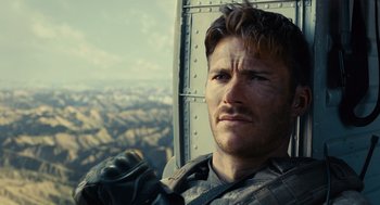 Movie still from “The Outpost” (2019), directed by Rod Lurie – A person in a helicopter; Close Up shot, Over the shoulder angle
