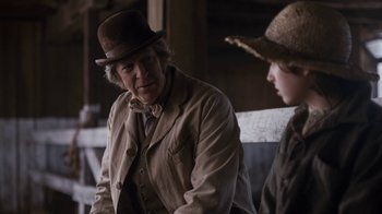 Movie still from “Anne with an E” (2017), created by Moira Walley-Beckett – A man and a boy wearing hats and coats; Medium shot, Over the shoulder angle