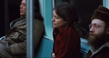 Movie still from “The Panic in Needle Park” (1971), directed by Jerry Schatzberg – A woman sitting on a train looking out of the window; Close Up shot, Over the shoulder angle