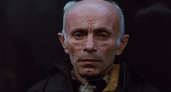 Movie still from “The Panic in Needle Park” (1971), directed by Jerry Schatzberg – An older man with a shaved head and a beard; Close Up shot, Low angle