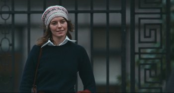 Movie still from “The Panic in Needle Park” (1971), directed by Jerry Schatzberg – A woman wearing a sweater and a hat; Medium shot, Low angle