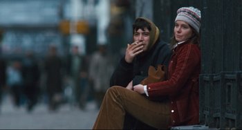 Movie still from “The Panic in Needle Park” (1971), directed by Jerry Schatzberg – A man and a woman sitting next to each other on a bench; Medium shot, Low angle