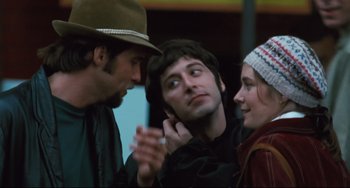 Movie still from “The Panic in Needle Park” (1971), directed by Jerry Schatzberg – A man and two women talking to each other; Close Up shot, Over the shoulder angle