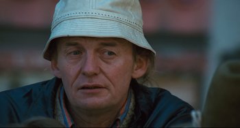 Movie still from “The Panic in Needle Park” (1971), directed by Jerry Schatzberg – A person wearing a hat; Close Up shot, High angle