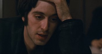 Movie still from “The Panic in Needle Park” (1971), directed by Jerry Schatzberg – A person holding his hand to his head; Close Up shot, High angle