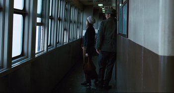Movie still from “The Panic in Needle Park” (1971), directed by Jerry Schatzberg – A man and a woman walking down a hallway; Wide shot, Low angle