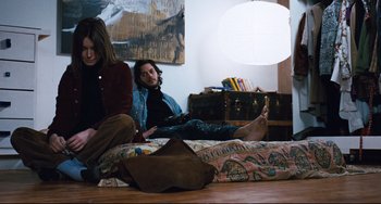 Movie still from “The Panic in Needle Park” (1971), directed by Jerry Schatzberg – A man and a woman sitting on a bed; Wide shot, High angle