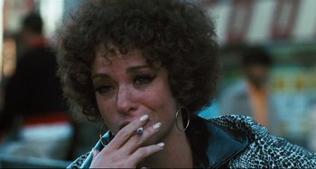 Movie still from “The Panic in Needle Park” (1971), directed by Jerry Schatzberg – A person smoking a cigarette; Close Up shot, Over the shoulder angle