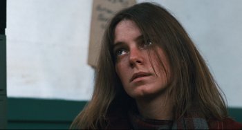 Movie still from “The Panic in Needle Park” (1971), directed by Jerry Schatzberg – A person with long brown hair; Close Up shot, Low angle