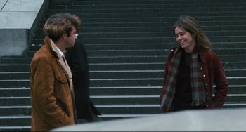 Movie still from “The Panic in Needle Park” (1971), directed by Jerry Schatzberg – A man and a woman talking on some steps; Medium shot, Over the shoulder angle