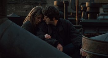 Movie still from “The Panic in Needle Park” (1971), directed by Jerry Schatzberg – A man and a woman sitting next to each other; Medium shot, High angle